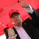 Then-candidate Donald Trump enjoys one of his favorite post-breakfast, pre-lunch snacks: pork chop on a stick. (Photo: Win McNamee/Getty Images)